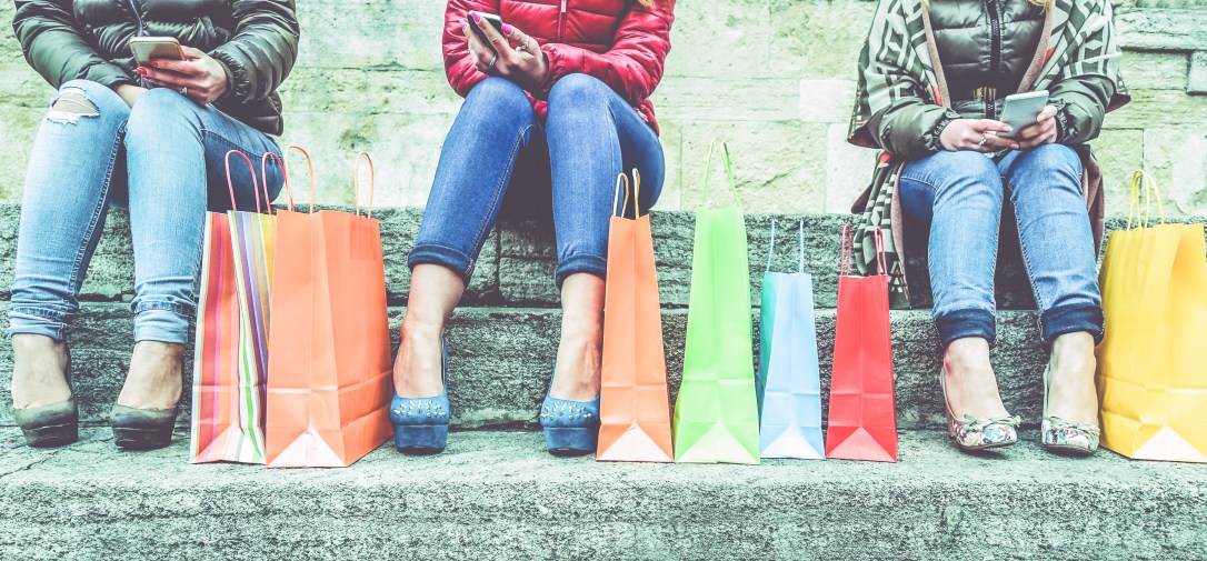 Women using smartphone for online shopping